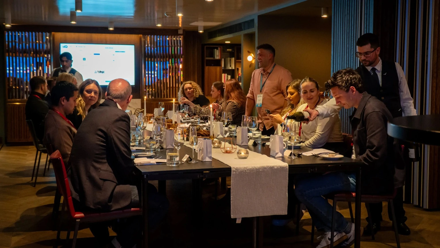 A small business gathering around a dinner table
